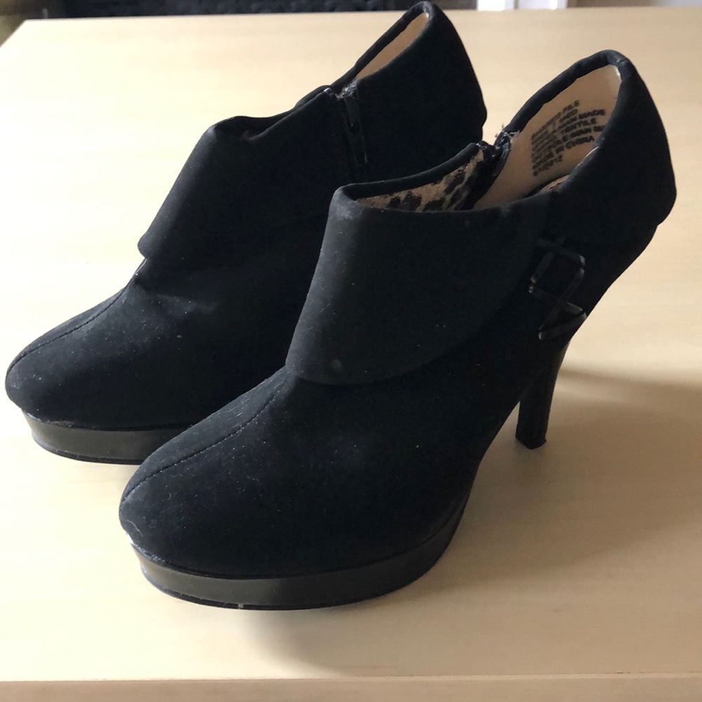 Pair of black suede heeled booties